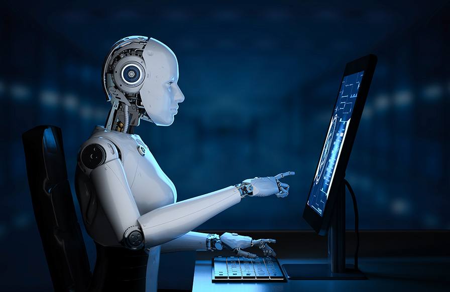 white robot using a computer in a dark room