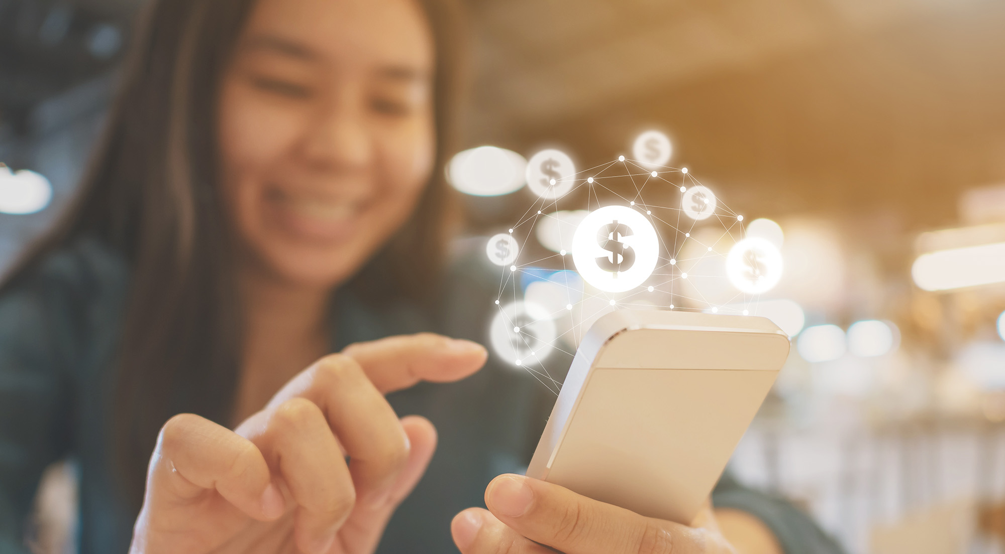 A Gen Z girl uses her mobile phone with financial graphics to indicate she's using online banking