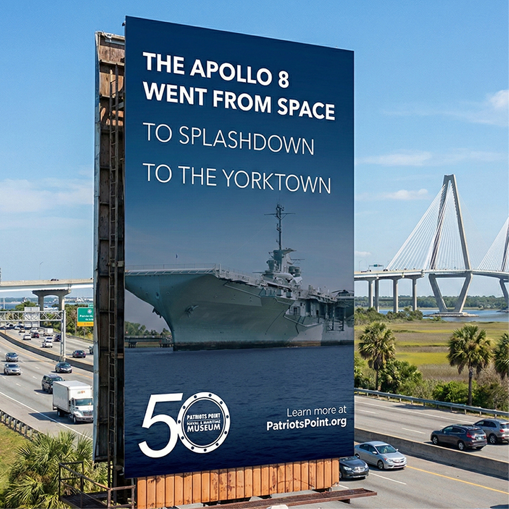Billboard showing USS Yorktown and pier with American flags