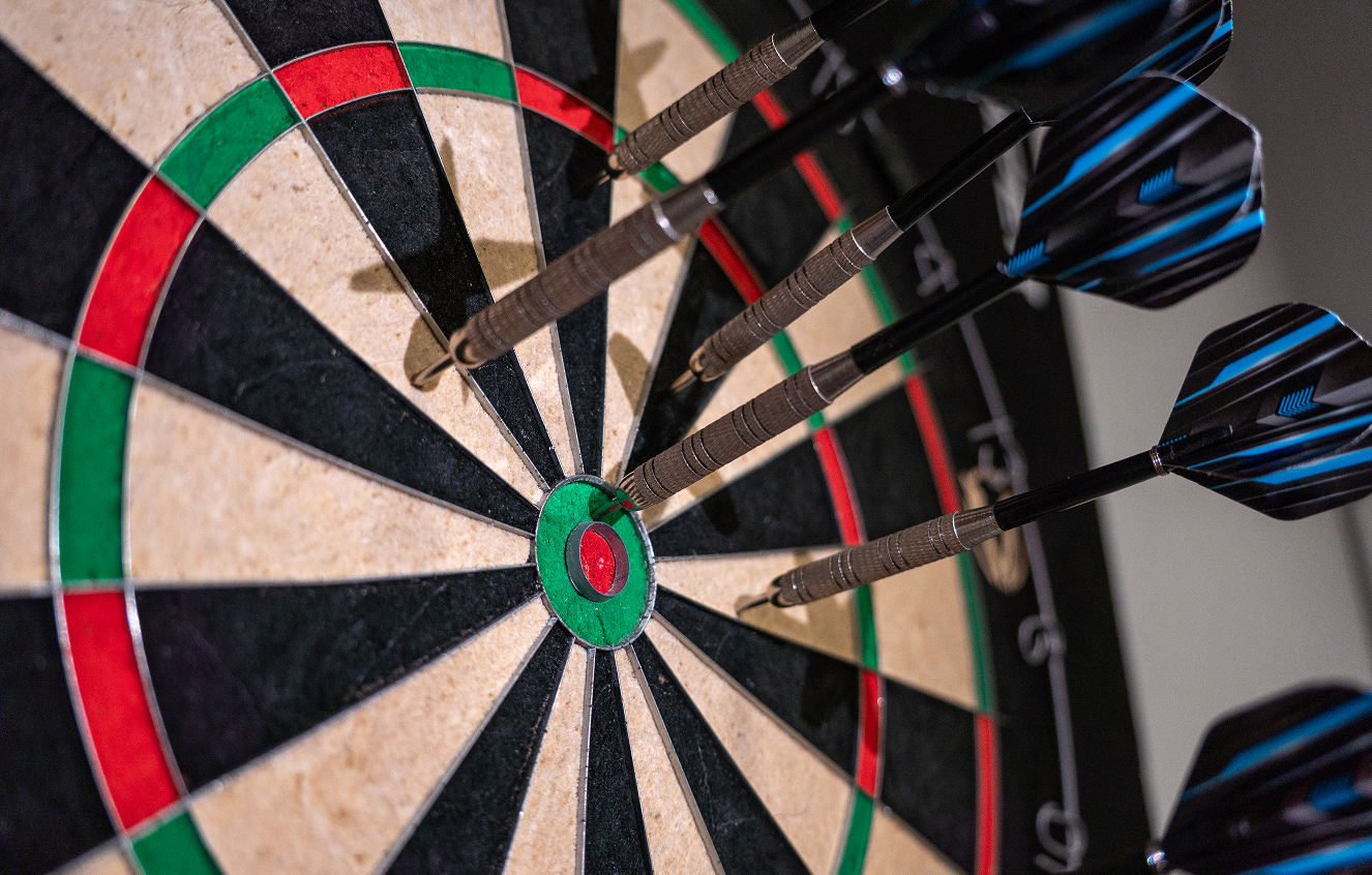 Darts clustered around the bullseye
